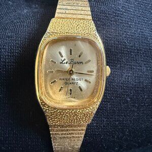 vintage Le Baron quartz watch with a gold-tone finish
